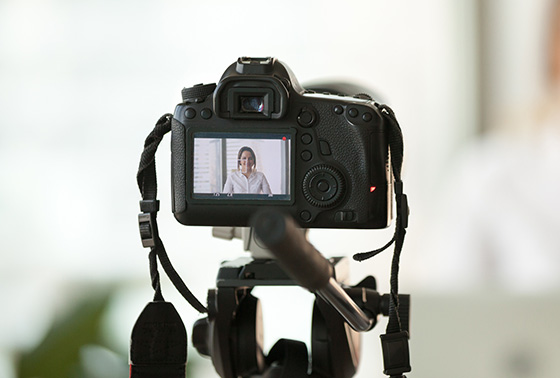 Camera filming women thumb